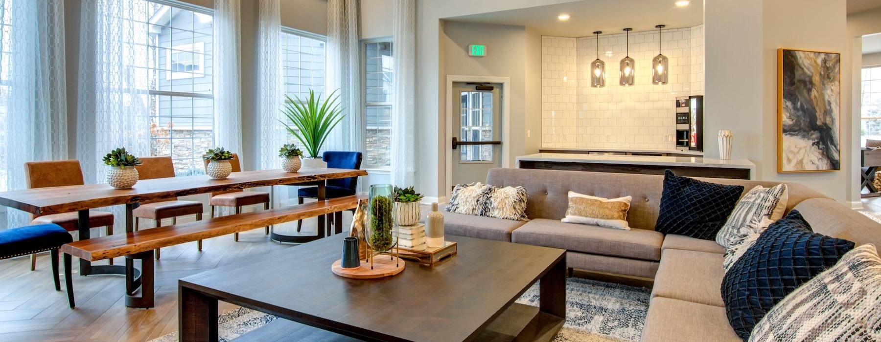 a clubroom with tables, chairs and a couch