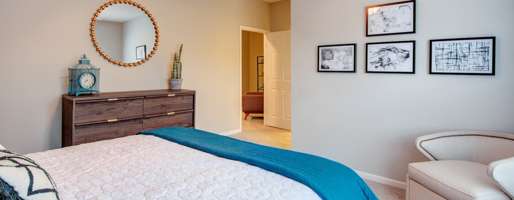 a bedroom with a bed and a mirror