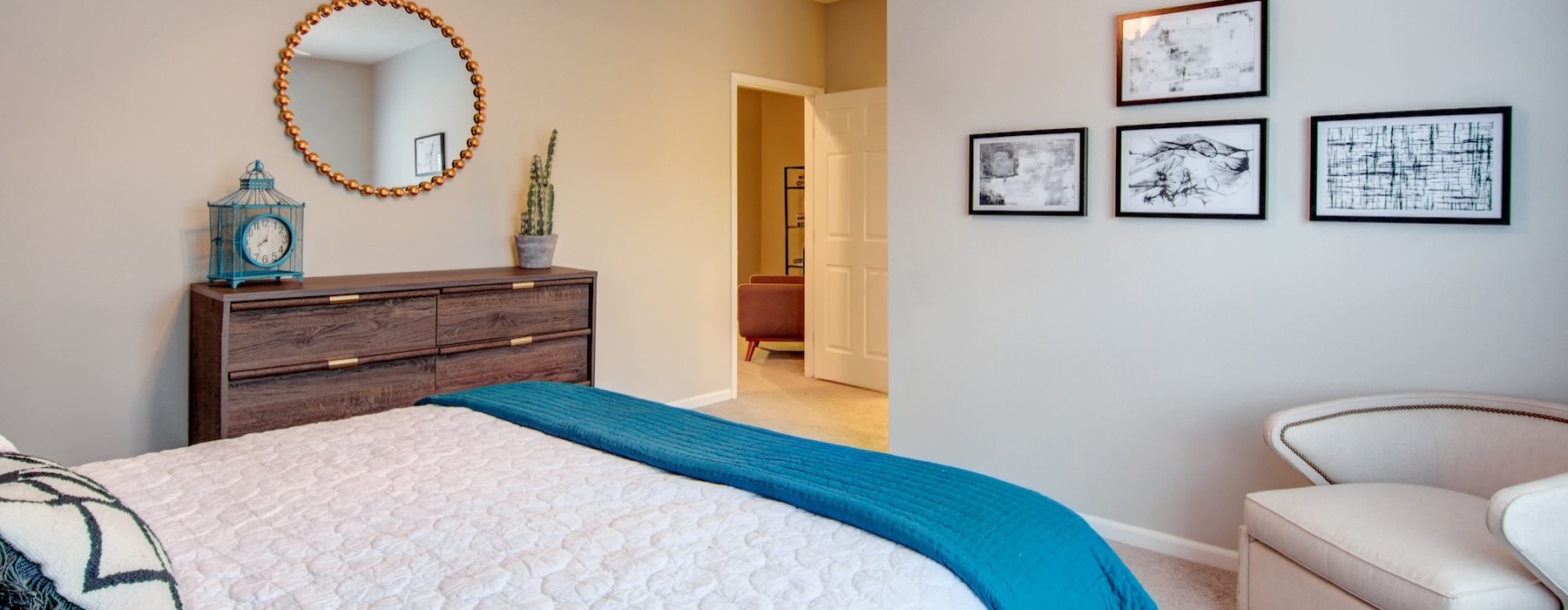 a bedroom with a bed and a mirror
